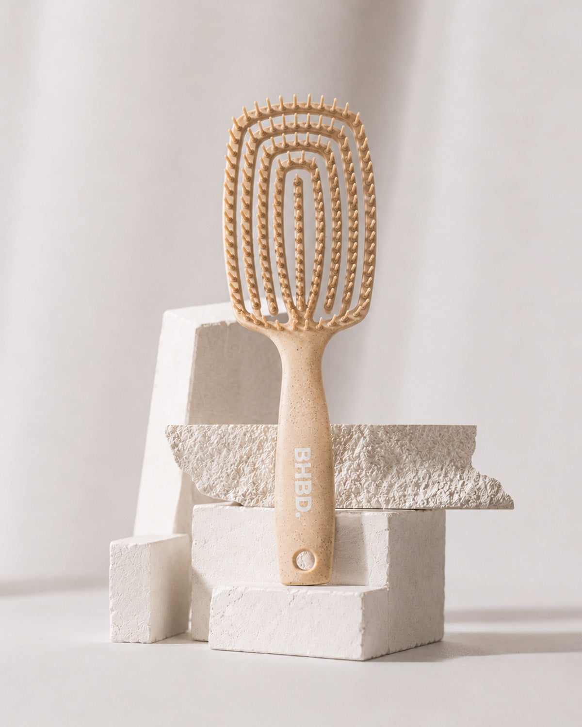 Wet detangler brush with flexible bristles designed to gently detangle wet and dry hair.
