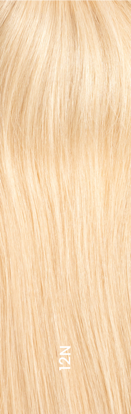 Close-up of hair topper in shade 12N, light blond color with natural texture and shine.