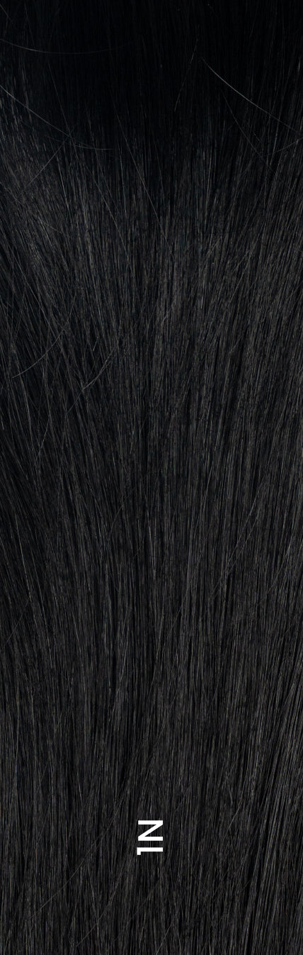 Close-up of hair topper in deep black shade (1N) with sleek, natural-looking texture.