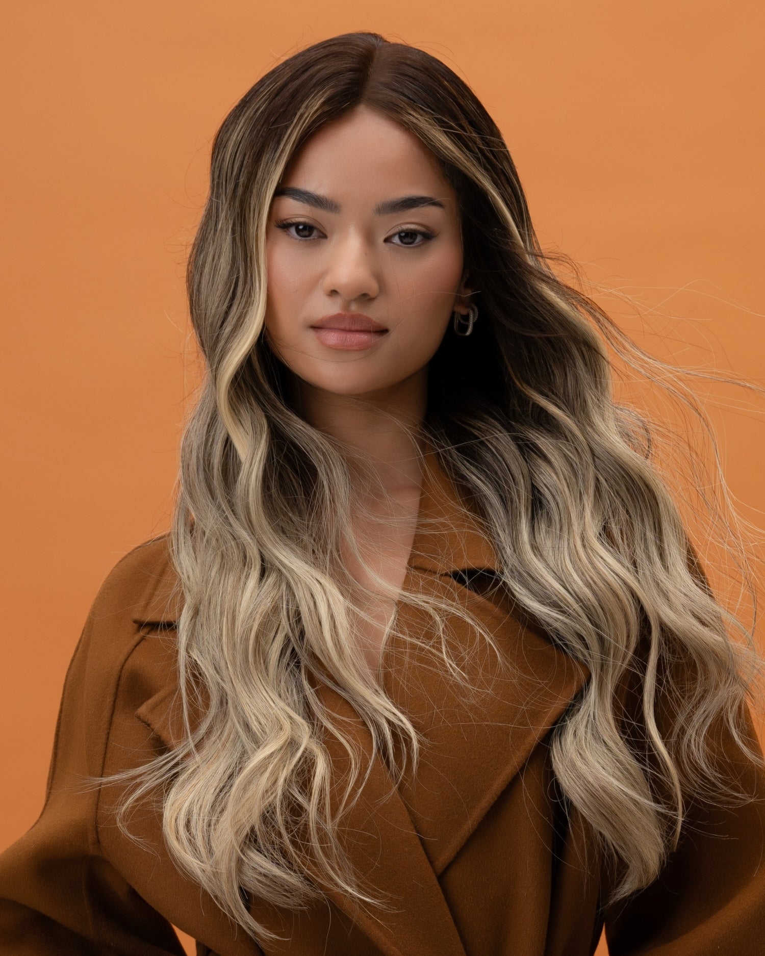 Balayage Wig 50 cm human hair with rich brown roots blending into warm blonde and brown tones, shown on model for natural dimension.
