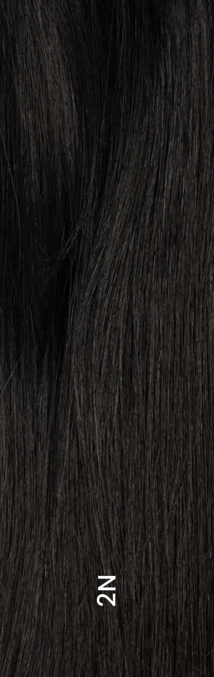 Close-up of hair topper in shade 2N, dark brown/black color with natural texture and shine.