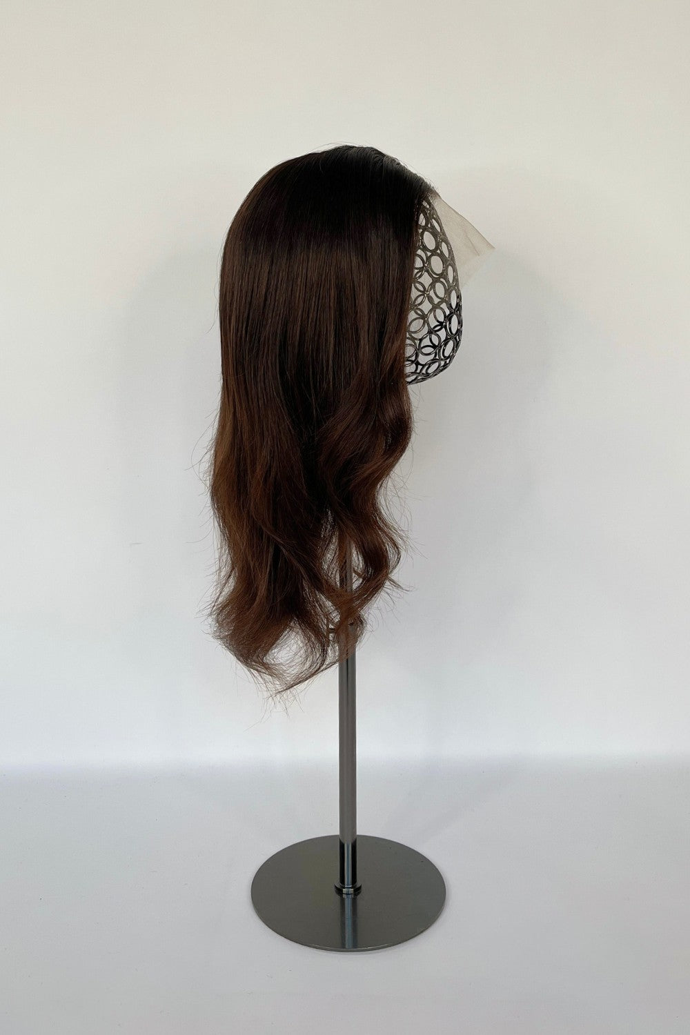 BHBD full lace wig in a rich chestnut brown shade with soft, natural waves. Made with 100% real Remy hair, providing a realistic parting and seamless fit for versatile styling.