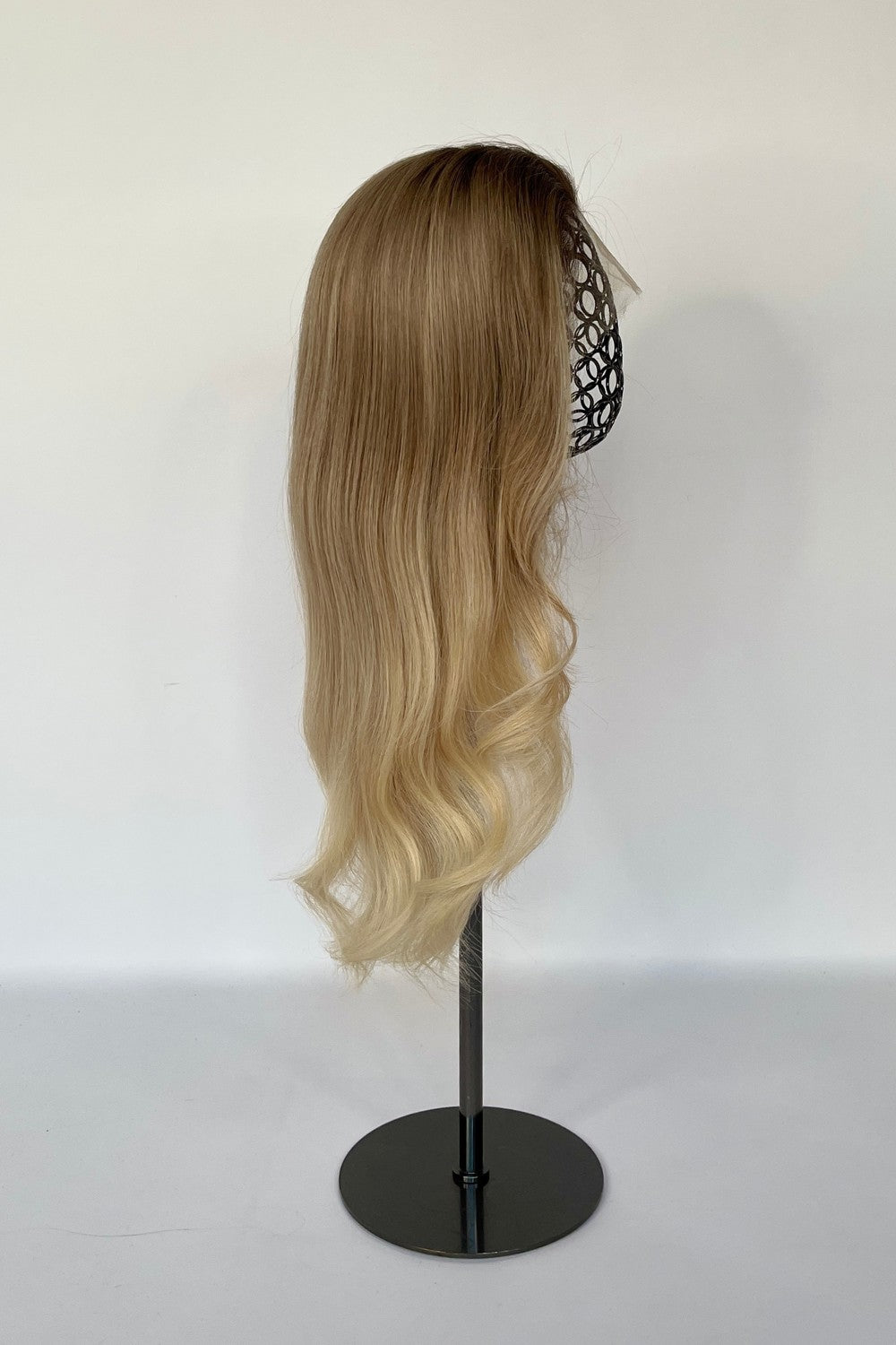 BHBD full och half lace wig in an ash blonde ombré shade, transitioning to soft, light blonde waves. Made with 100% real Remy hair, offering a natural parting and seamless styling versatility.