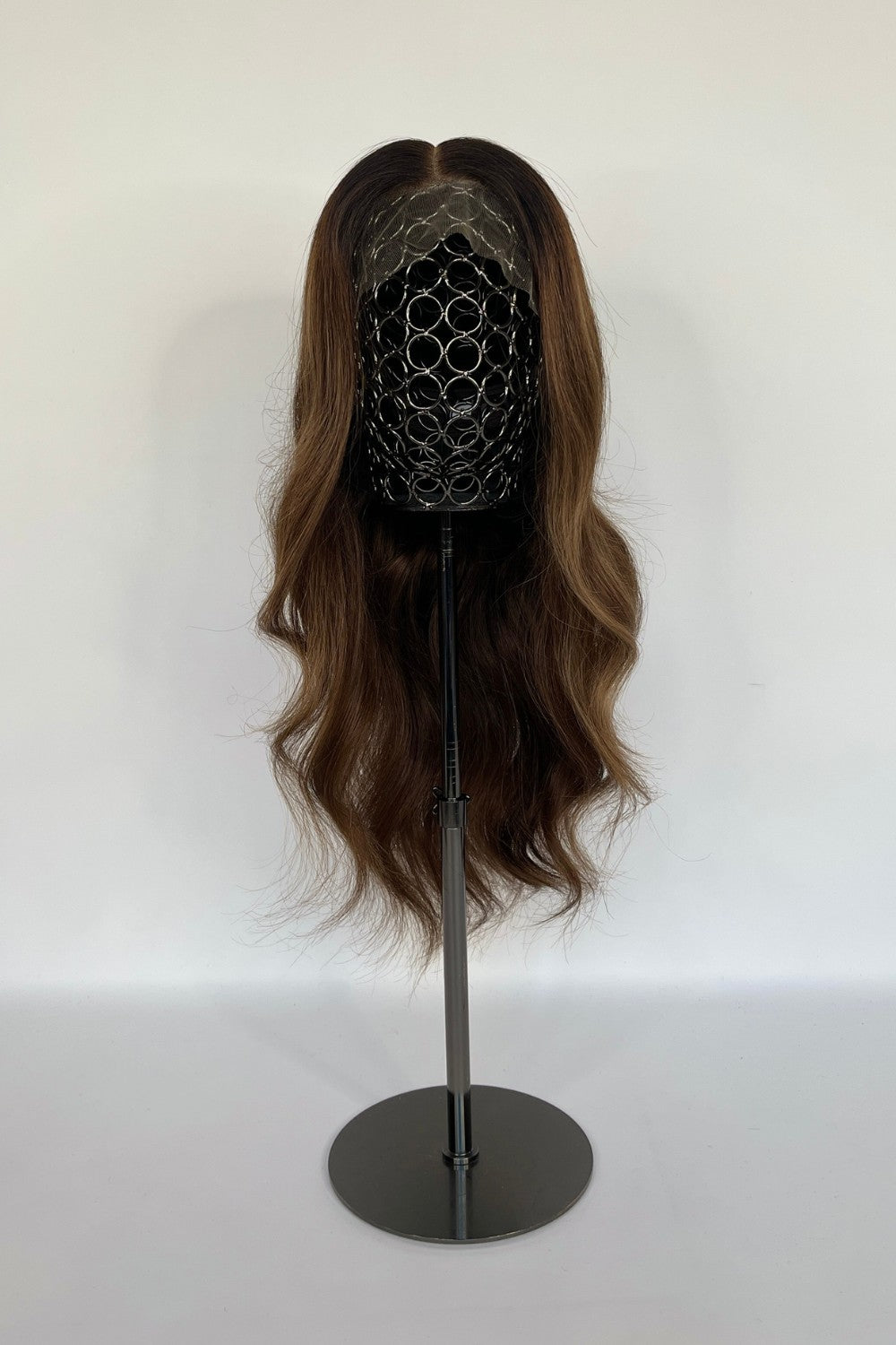 BHBD lace wig in a warm chestnut brown shade with soft, natural waves. Made with 100% real Remy hair, providing a seamless fit and natural parting for versatile styling options.