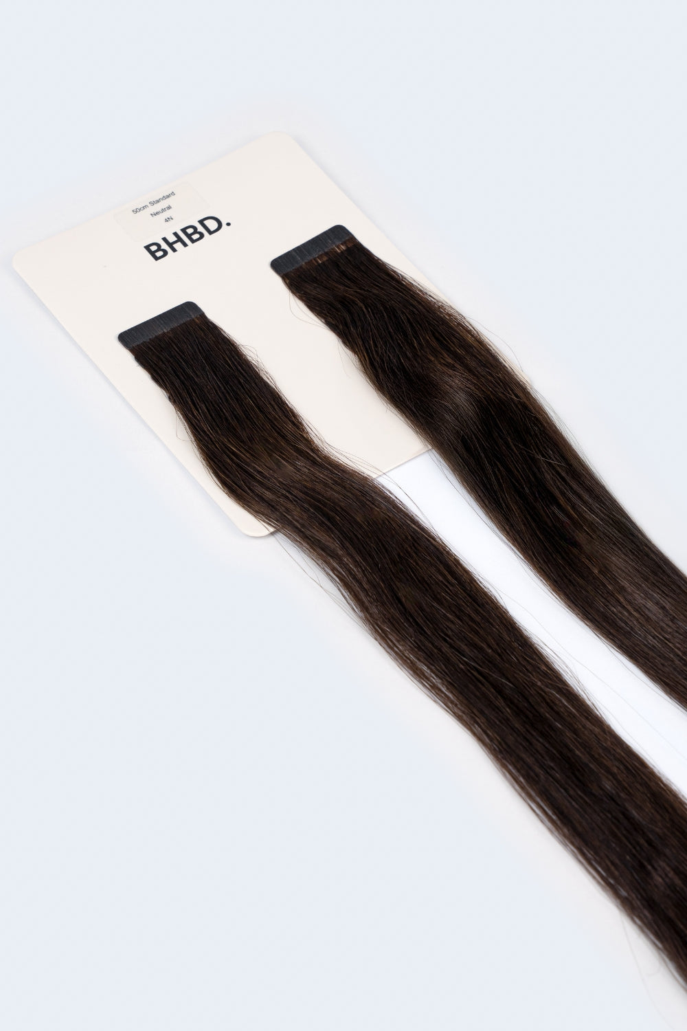 BHBD Tape Extensions 4N – pre-taped Remy human hair extensions in deep natural dark brown; seamless, soft and tangle-free; comes in 35cm, 50cm, and 60cm. 100% Remy hair, gentle extensions.
