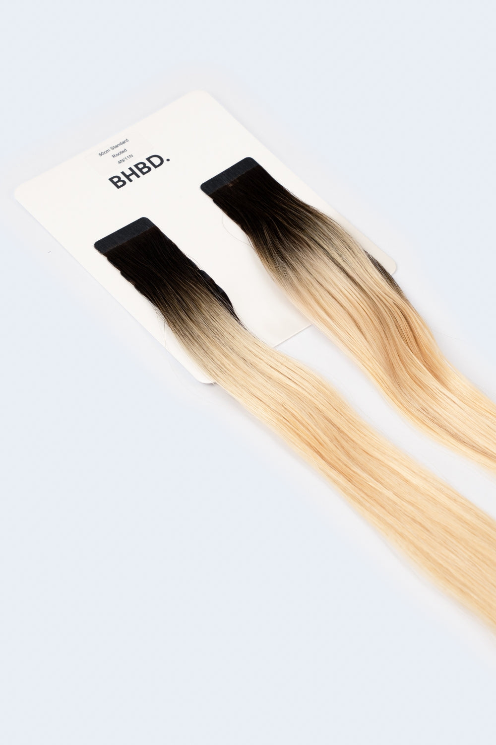 BHBD Tape Extensions 4N/11N – pre-taped Remy human hair extensions in ombré dark brown to blonde; seamless, soft and tangle-free; comes in 35cm, 50cm, and 60cm. 100% Remy hair, gentle extensions.