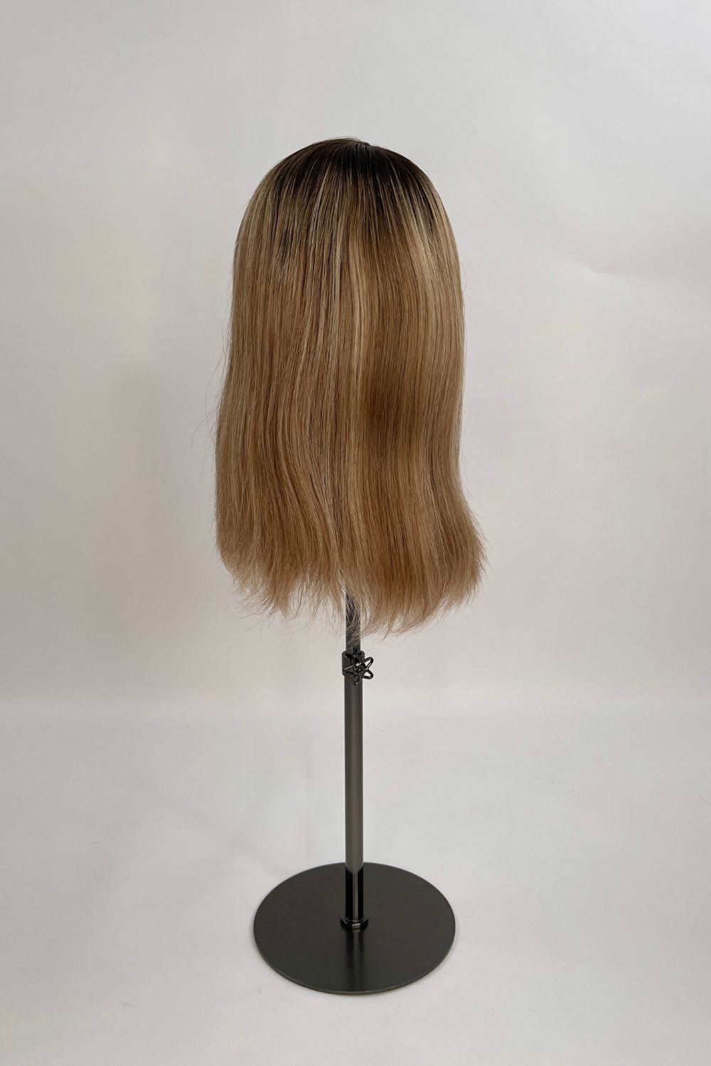 Serena Wig – dark brown root lighter brown lengths, 30cm full-lace wig; 100% Remy hair with transparent Swiss lace; shown on wig stand from back.
