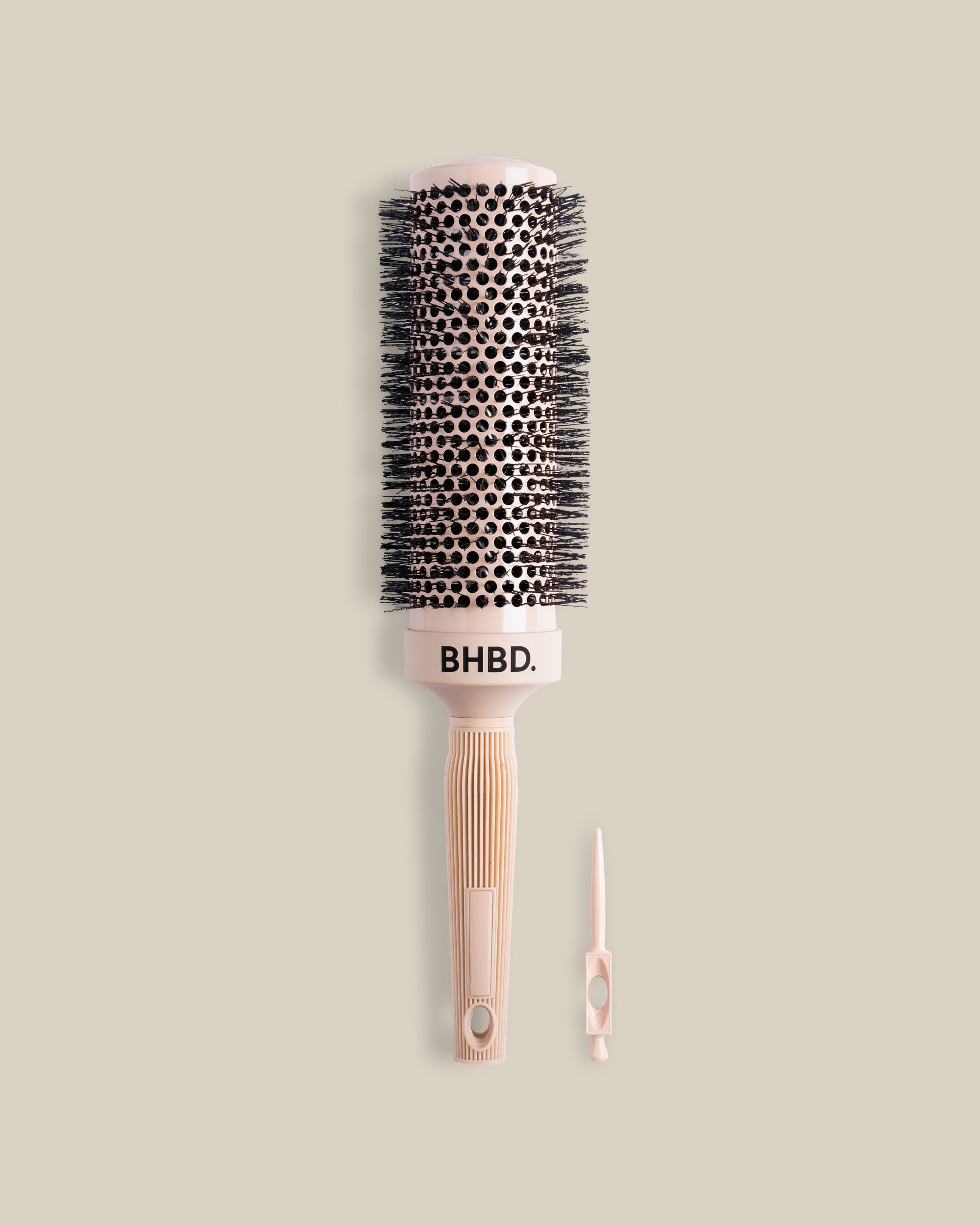 BHBD Round Brush 53 – ceramic ionic round brush for faster drying and smooth, shiny hair. 53mm barrel for volume and styling. Black bristle head and beige handle.