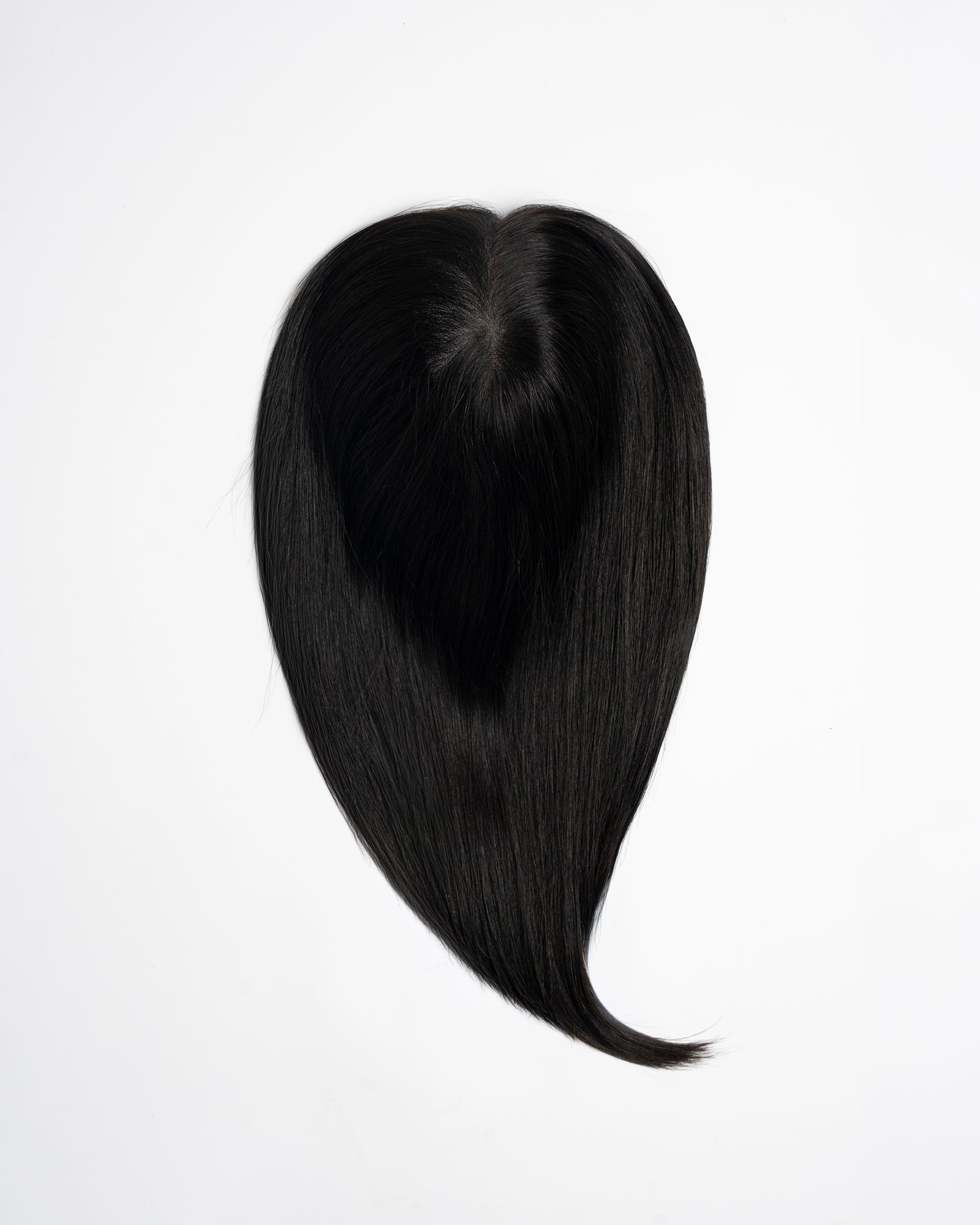 Hair topper in dark brown/black shade (2N) with natural volume and length on a white background.