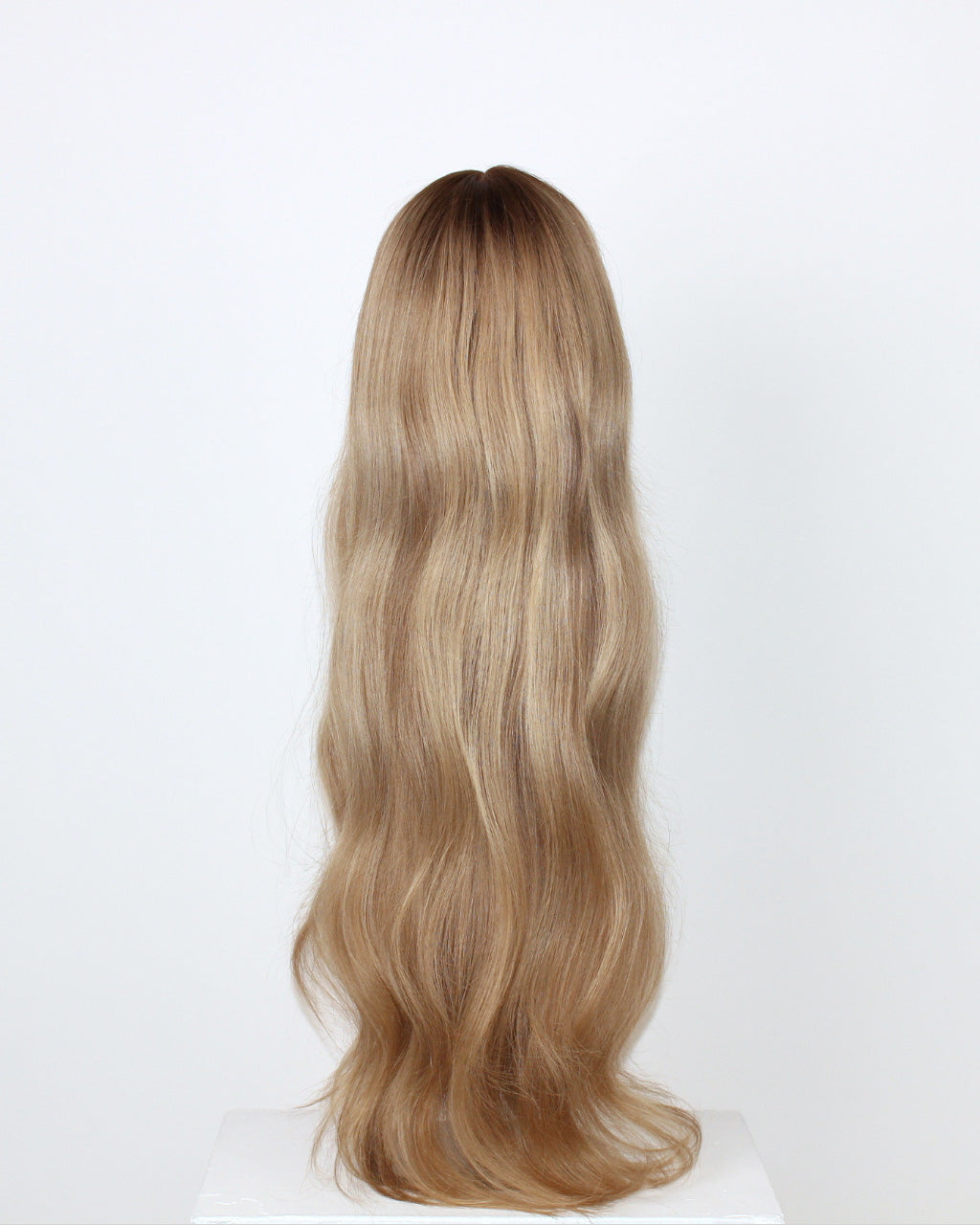 BHBD Lana Wig 65 cm – back view of cool caramel blonde human hair wig with darker roots and soft 65 cm layers displayed on a white background