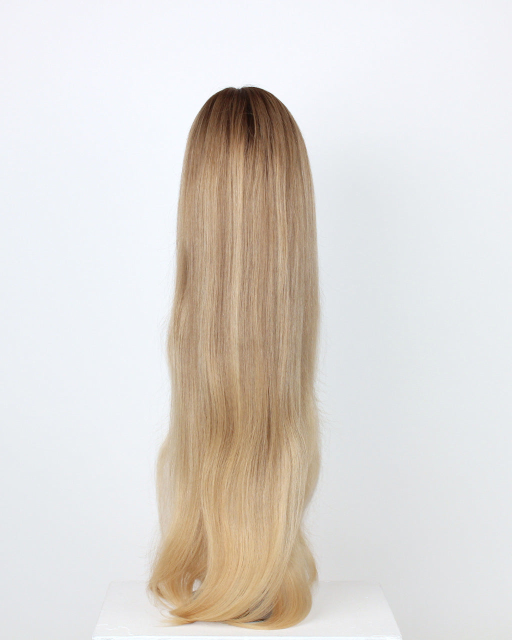BHBD Mila Wig 65 cm – back view of cool medium blonde human hair wig transitioning into a light warm blonde length with softly layered 65 cm length displayed on a wig stand against a white background