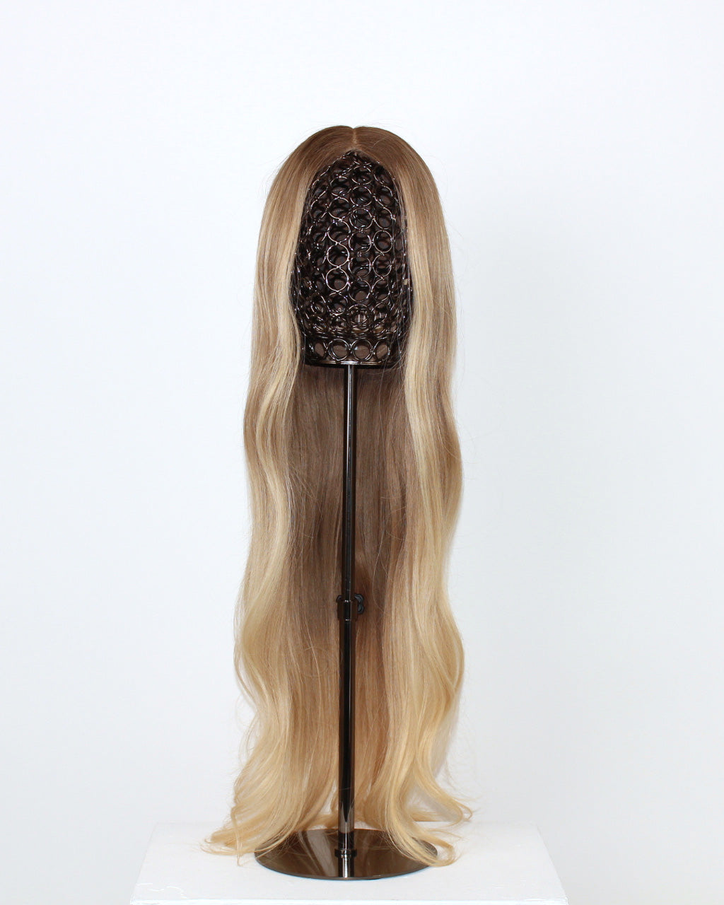 BHBD Mila Wig 65 cm – cool medium blonde human hair wig transitioning into a light warm blonde length with softly layered 65 cm length displayed on a wig stand against a white background
