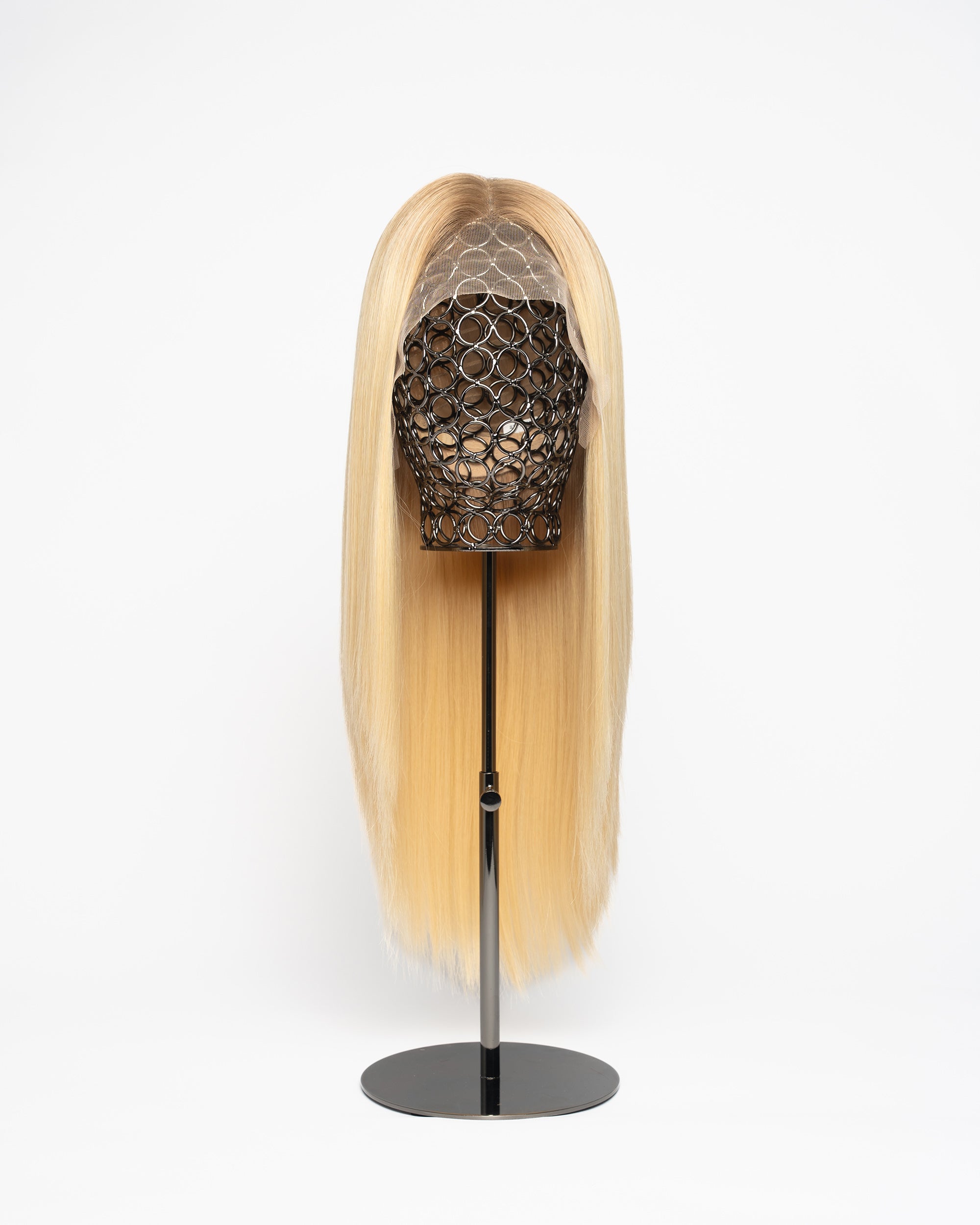 Blonde wig on a stand with a white background