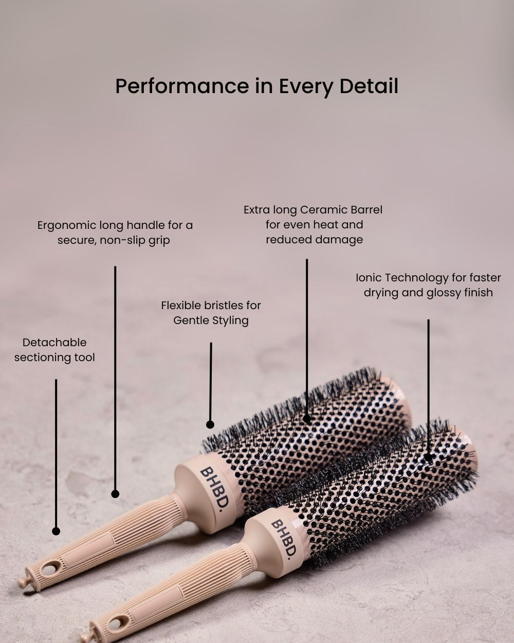 BHBD round brushes placed on a neutral surface, highlighting their ergonomic long handles, detachable sectioning tools, ceramic barrels, flexible bristles, and ionic technology for professional styling and reduced frizz.
