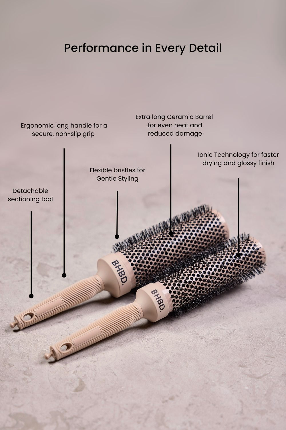 wo BHBD round brushes placed on a neutral surface, highlighting their ergonomic long handles, detachable sectioning tools, ceramic barrels, flexible bristles, and ionic technology for professional styling and reduced frizz.