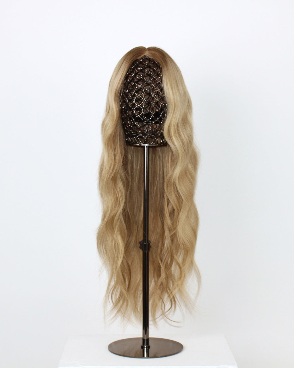 Scarlet Wig 50 cm natural blonde human hair wig with dark root and fine lowlights for dimension, hand-tied on HD lace front, displayed on stand. Front view
