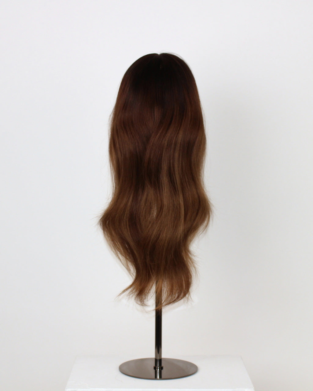 Brunette Balayage Wig 40 cm Remy human hair wig with warm brown blend and layered texture, dark roots fading to lighter lengths, displayed on stand.Back view