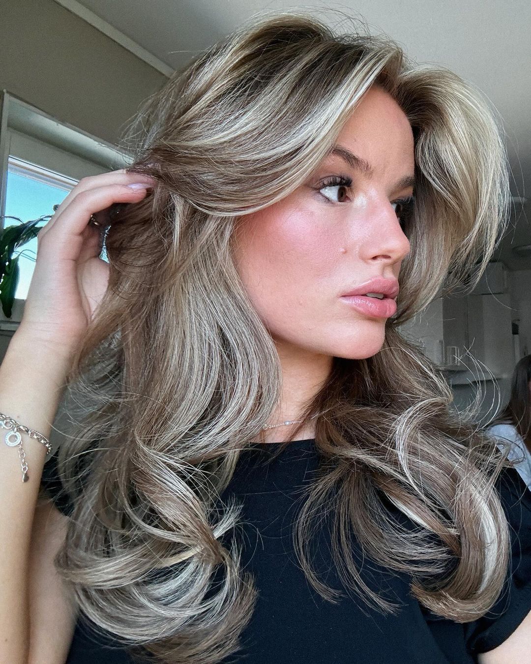 Woman with long brown hair created with BHBD hair extensions.