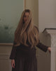 woman wearing bhbd premium wig sharp. The hair moving softly in the wind.