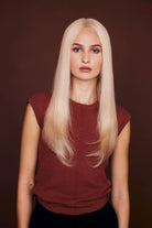 Model wears BHBD pure wig: 45 cm in Platinum blonde perfection! Our Remy human hair wig is soft, tangle-free & features a natural hairline.